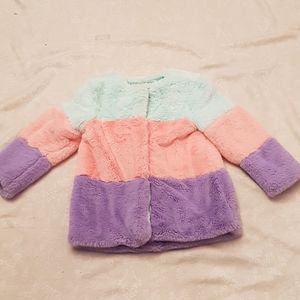 Faux fur coat in pastel colors